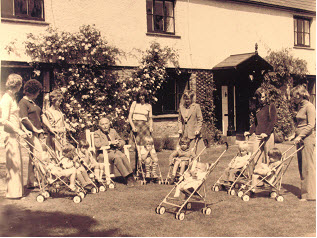Owen Maclaren with Baby Buggies outside Arnold House
